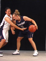 Still from Janet Biggs Video Installation 'One on One' - Connecticut women's basketball players Morgan Valley and Maria Conlon